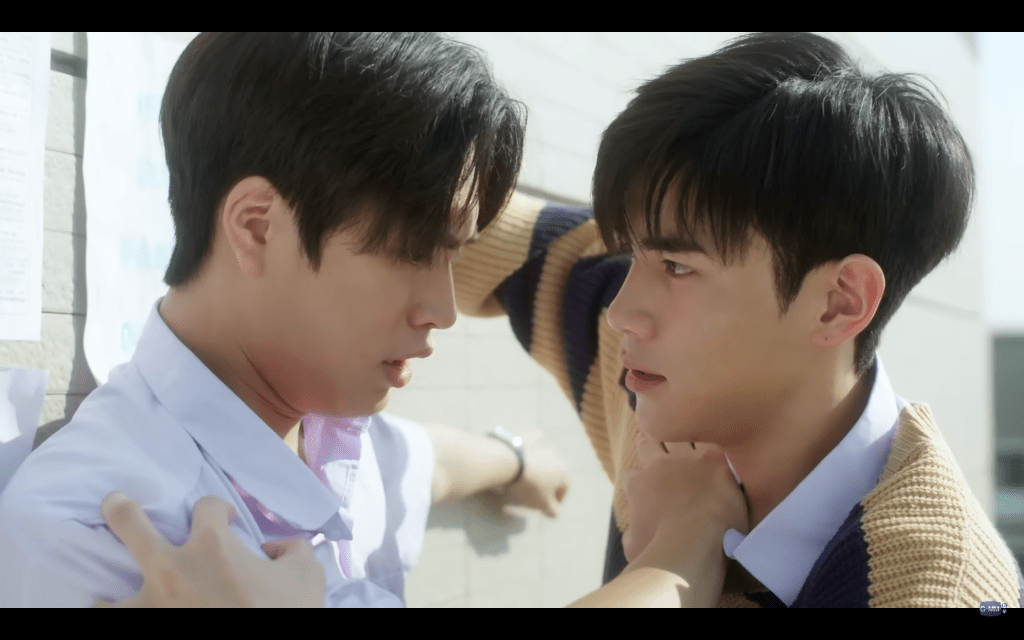 Two male students enroaching on each other's personal space