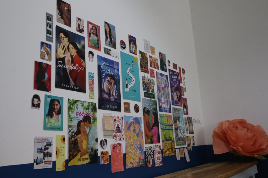 A wall full of #romanceclass books covers